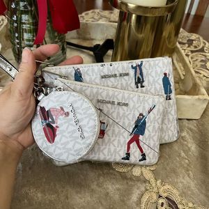 Michael Kors trio wristlet